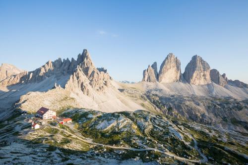 an aerial view of a mountain range with a house at Residenz Erschbaum in Valdaora