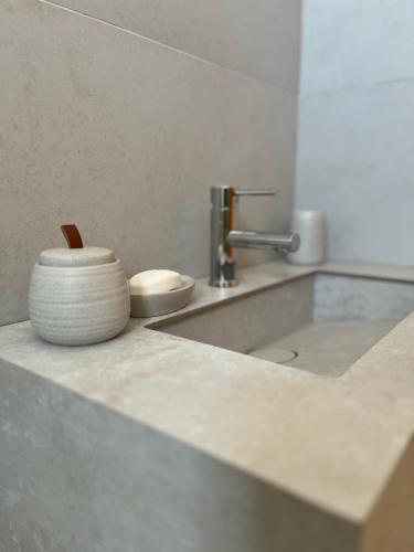 a kitchen counter with a sink and a bowl at Dar El Salem Villa de Haut Standing in Al Maqārisah