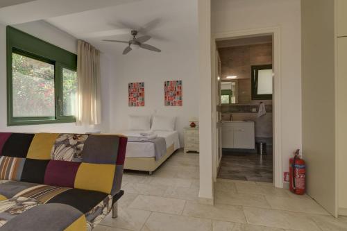 A bed or beds in a room at Ouzo Stone Studio