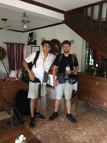 two men standing next to each other in a room at Villa25 Homestay free pick up from the centre in Kandy