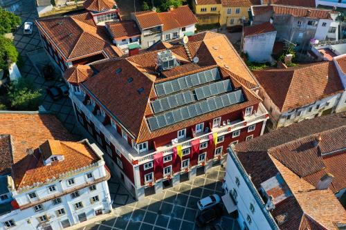 an overhead view of a city with red roofs at Hotel dos Cavaleiros in Torres Novas