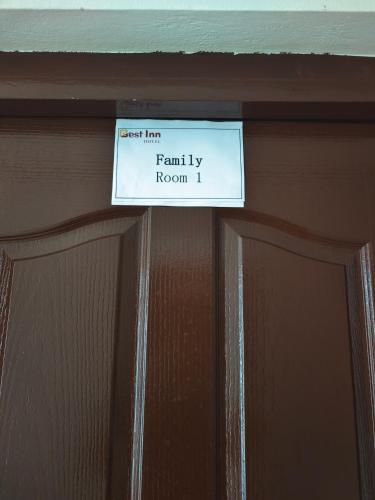 a sign that reads family by room on a door at Best Inn Lahug in Cebu City