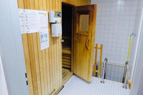 a bathroom with a door leading to a small room at Ferienwohnung im Schwarzwald in Unterkirnach