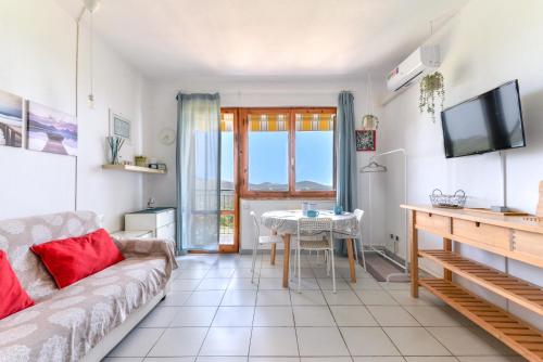 a living room with a couch and a table at Le Lecce 34 in Capoliveri