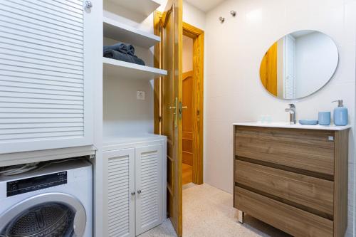 a laundry room with a washer and dryer and a sink at Holidays2Malaga Victoria 40 Quiet & Central in Málaga