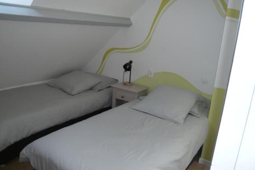 Ein Bett oder Betten in einem Zimmer der Unterkunft Gite de la Vallée de Mai