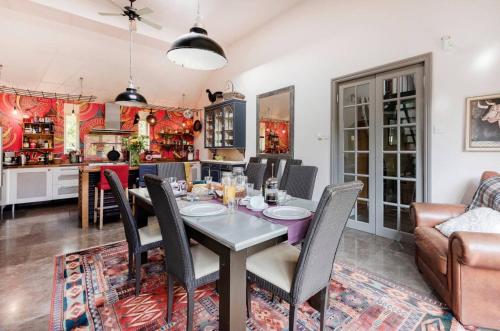 a dining room with a table and chairs at Orchard Paddocks in Guildford