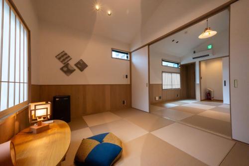 an empty room with a table and a chair in a building at Irodori Hotel AI in Fukuoka
