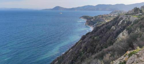 an aerial view of the ocean and a mountain at Casa vacanze il Pastore Tedesco in Portoferraio