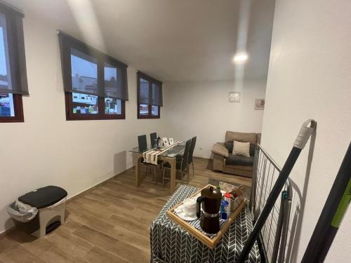 a living room with a table and a dining room at Loft Fontanales in Agua de Fontanales