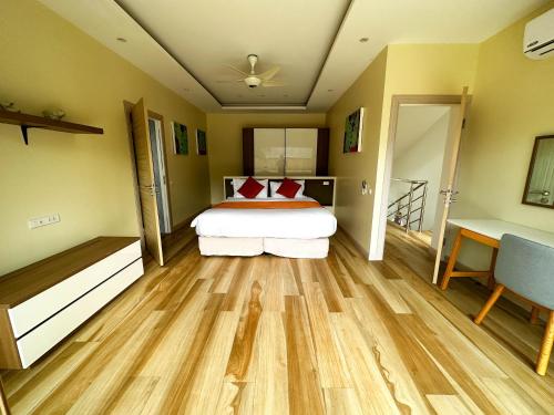 a bedroom with a bed with red pillows on it at villa Mojito in Koh Samui