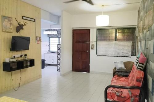 Μια τηλεόραση ή/και κέντρο ψυχαγωγίας στο Comfy Home Near to Penang Hill