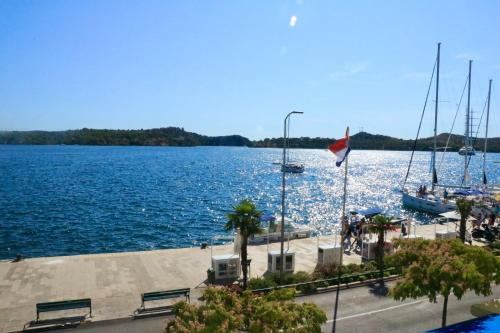 a view of a large body of water with boats at Appartment Riva view in Šibenik