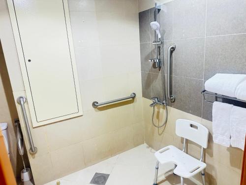 a bathroom with a shower with a toilet and a sink at Nusk Al Madinah in Medina