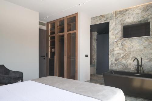 Ένα ή περισσότερα κρεβάτια σε δωμάτιο στο The Aqua Villa