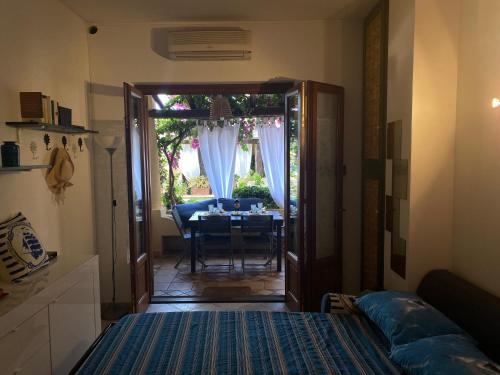 a room with a table and a dining room at Casa Bouganville, vista mare! in Lipari