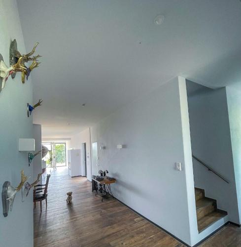 a living room with a blue wall and stairs at Privatzimmer nahe Legoland in Niederstotzingen