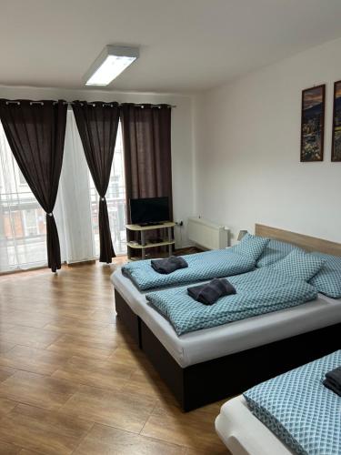 Postel nebo postele na pokoji v ubytování Kondé Apartments B
