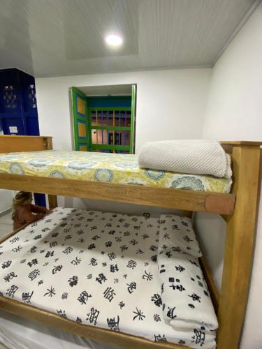 two bunk beds in a small room with at Apartamento guatape in Guatapé