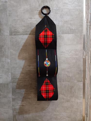 a black and red bag hanging on a wall at Kisuri Resort in Sena