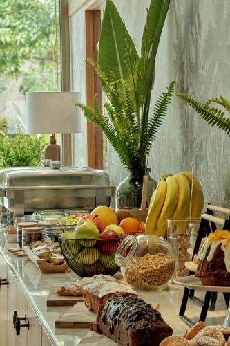 a counter with many different types of food on it at Golden Sun Hotel in Athens
