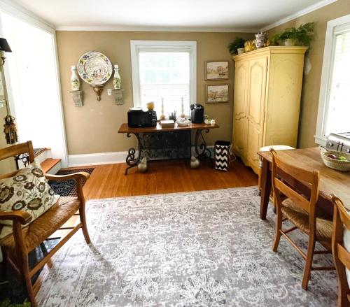 a living room with a table and a desk at 9 Booth Lane in Haverford