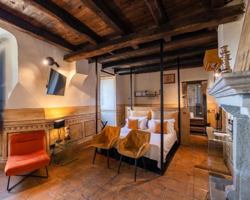 a bedroom with a bed and a table and chairs at Castello di Limatola in Limatola