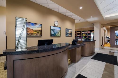 a lobby of a hotel with a reception desk at Hotel 11, MOD A Sonesta Collection in Calgary