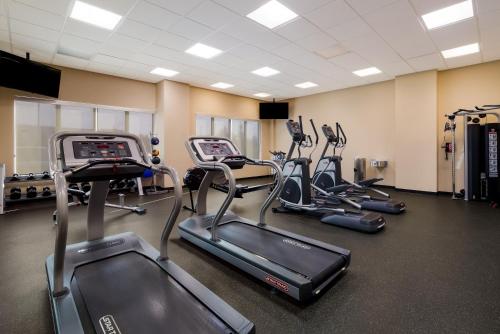 a gym with several treadmills and cardio machines at Hotel 11, MOD A Sonesta Collection in Calgary