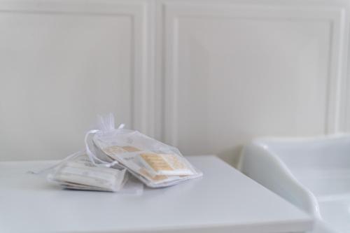 a white table with a bag of food on it at B&B Villa Eden jacuzzi pool in Domaso