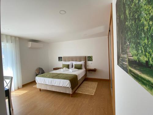 מיטה או מיטות בחדר ב-Casa da Gândara