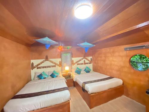 Postel nebo postele na pokoji v ubytování Lung Soi Nguen Homstay Pang Oung