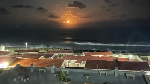 a view of the sunset from the roof of a building at Ocean View in Margate