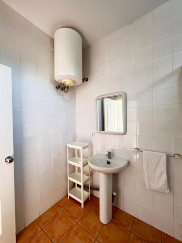 a bathroom with a sink and a mirror at #9 HABITACIÓN DOBLE AYAMONTE in Ayamonte
