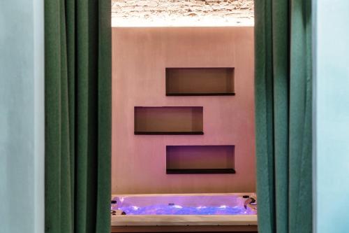 a view of a bath tub through a window at Suites Lorodellago Como - The House Of Travelers in Como
