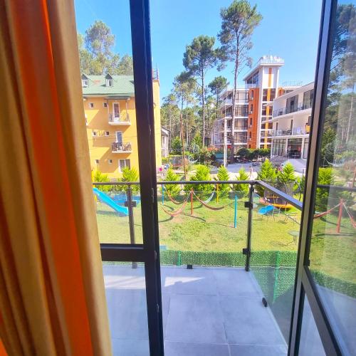 a view of a playground from the window of a apartment at Gina Apartments in Shekvetili
