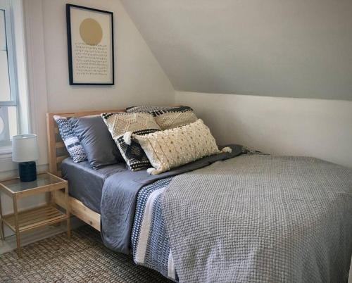 a bed with pillows on it in a bedroom at Parkman Pad in Montague in Montague