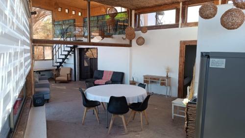 a room with a table and chairs in a room at Atacama Loft & Glamp in San Pedro de Atacama