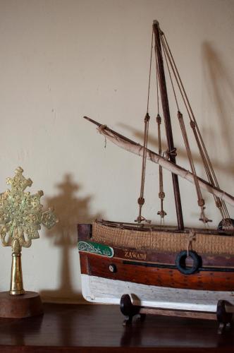 a toy boat sitting on top of a table at Maweni House - Beachfront, Pool, AC & Cook in Kilifi