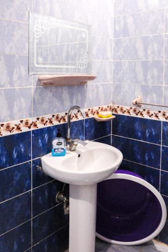 a bathroom with a sink and a toilet at Al-Manara Hostel Siwa Oasis in Siwa