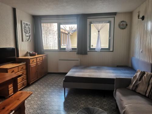 Postel nebo postele na pokoji v ubytování Studio spacieux au pied des pistes sans vue