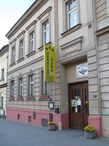 a building with a yellow sign in front of it at Pension Dáša in Tábor