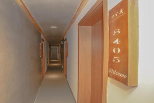 a long hallway with a sign on the wall at Cozy Boutique Hotel in Zhangjiajie
