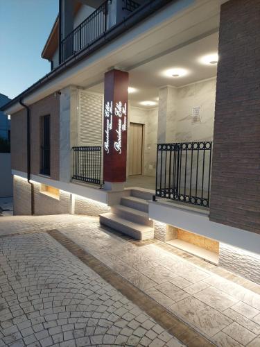 a building with a staircase on the side of it at Residenza Elba - Charme House in Termoli