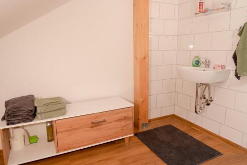 a bathroom with a sink and a toilet and a sink at Zur Feldsteinkirche 