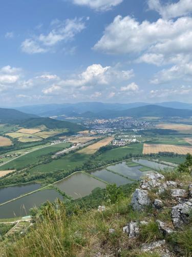 a view of a river from the top of a hill at Apartment Gemer & Apartment Volovec in Rožňava