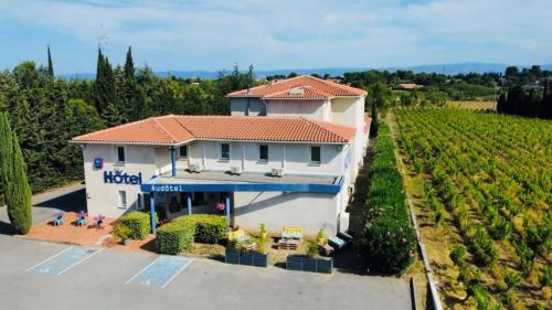 an aerial view of a house in a vineyard at Audotel in Carcassonne