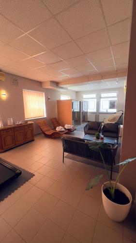 a large living room with a couch and a table at Bed and Breakfast Kreft in Ljutomer