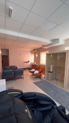 a large living room with a couch and chairs at Bed and Breakfast Kreft in Ljutomer