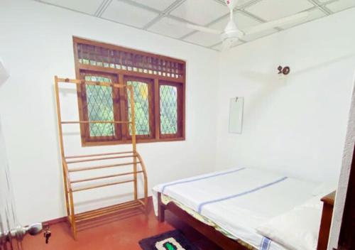 En eller flere senger på et rom på Nilwala River Corner Villa